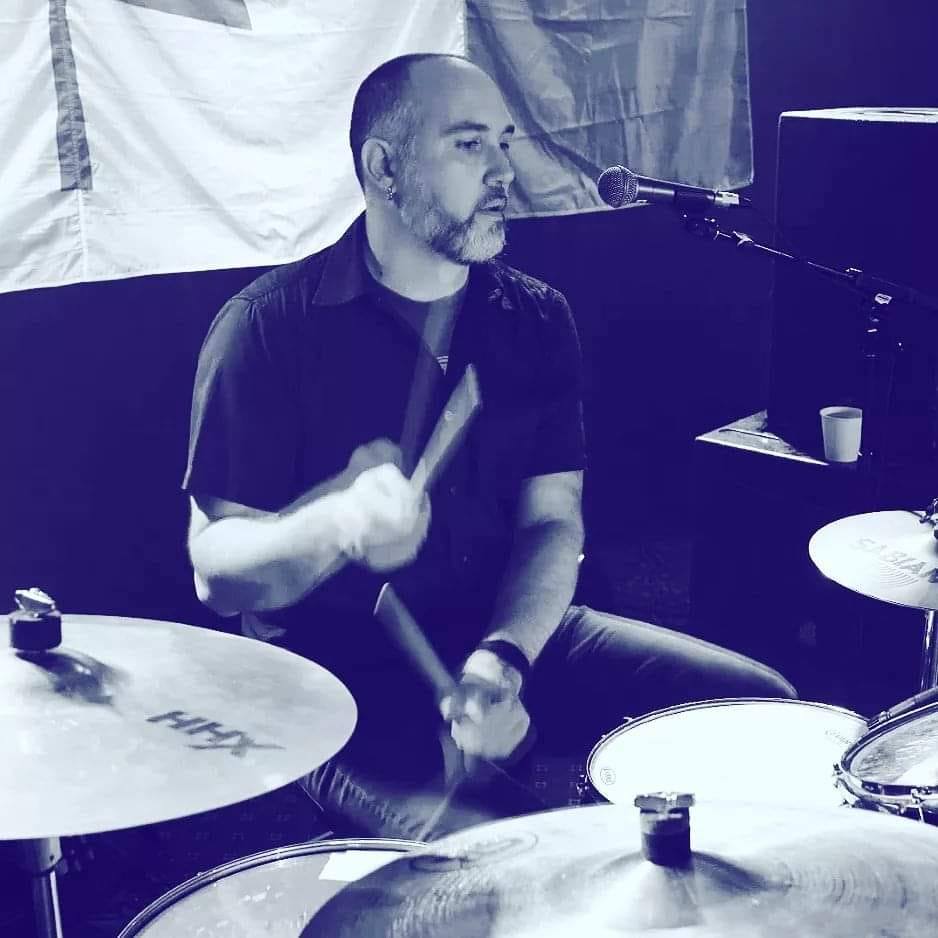 That's Kraken Hockey founder, Jason, playing drums.